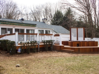 AFTER - STAMFORD CT  MULTI LEVEL DECK WITH HOT TUB. TROPICAL HARDWOOD CUMARU DECKING AND RAILING. YOUR LOCAL CONTRACTOR AND BUILDER