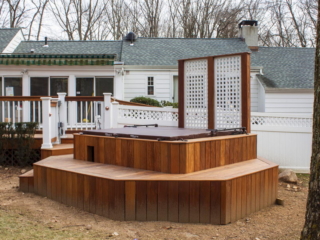 AFTER - STAMFORD CT  MULTI LEVEL DECK WITH HOT TUB. TROPICAL HARDWOOD CUMARU DECKING AND RAILING. YOUR LOCAL CONTRACTOR AND BUILDER