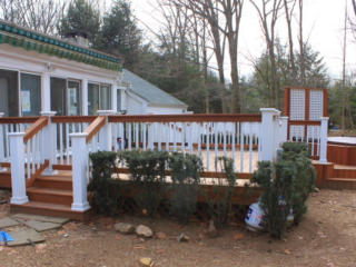 AFTER - STAMFORD CT  MULTI LEVEL DECK WITH HOT TUB. TROPICAL HARDWOOD CUMARU DECKING AND RAILING. YOUR LOCAL CONTRACTOR AND BUILDER