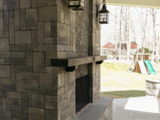 AFTER - GREENWICH CT Roof over patio with a huge custom skylight Build in outdoor kitchen grill and fireplace. Best local Builder