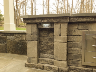 AFTER - GREENWICH CT Roof over patio with a huge custom skylight Build in outdoor kitchen grill and fireplace. Best local Builder