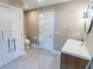 New Relocated Contemporary Bath(Frameless Glass Enclosure, Bench, Curbless Shower Entry, Floating Modern Vanity )