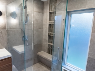 New Relocated Contemporary Bath(Frameless Glass Enclosure, Bench, Curbless Shower Entry, Floating Modern Vanity )