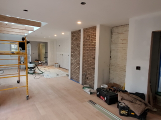 construction in progress. walls removed and open the ceiling for adding skylight