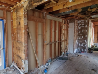 construction in progress. walls removed and open the ceiling for adding skylight