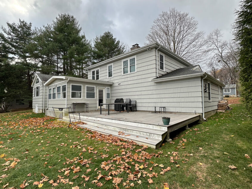 Before Front and rear exterior home renovation addition in Norwalk Before photo of home addition project in Norwalk